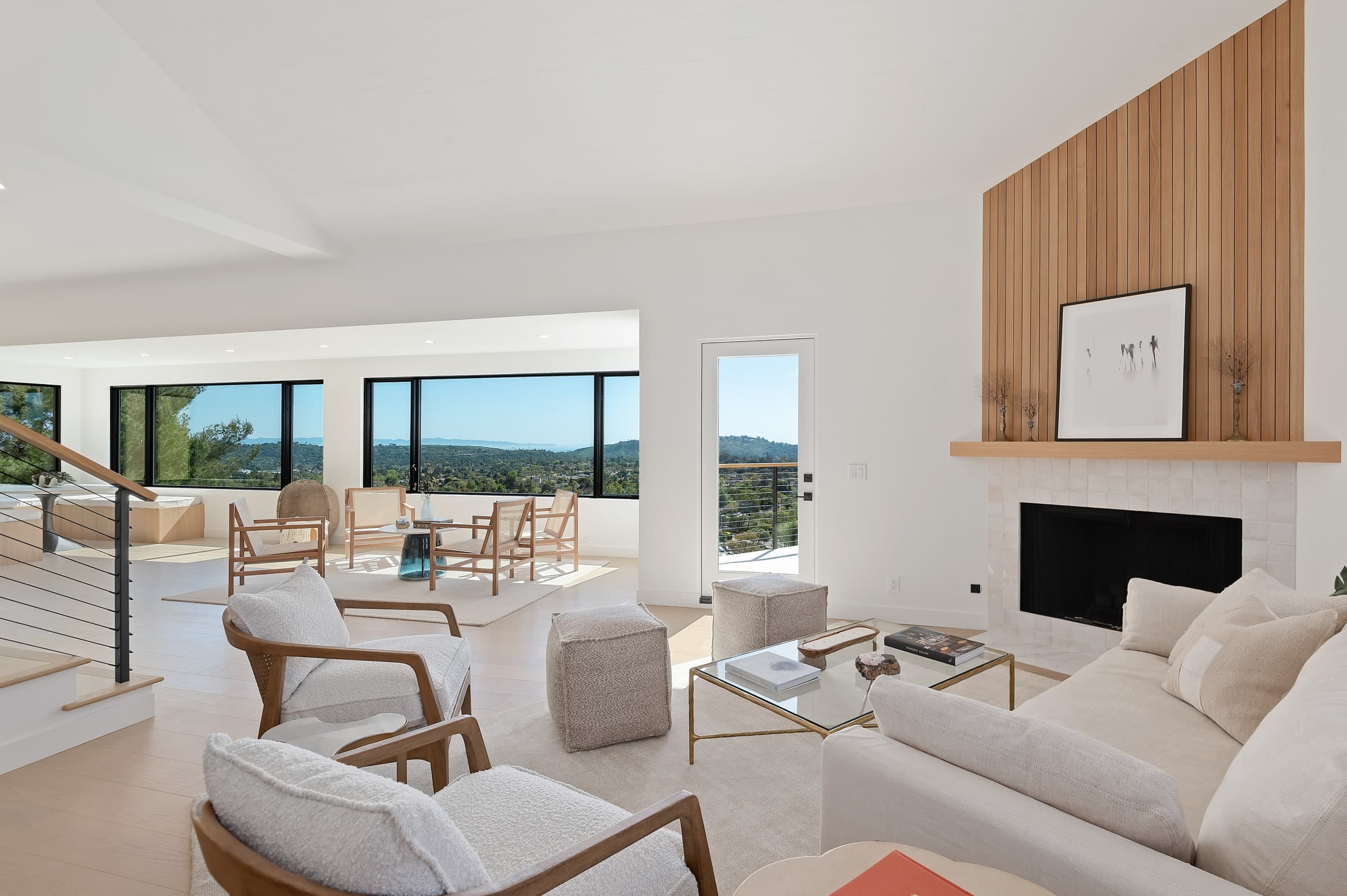 A DHRH full interior renovation on the Riviera with a stone fireplace and mountain views